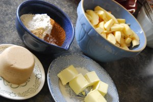 All the ingredients you'll need: flour, spices, brown sugar, apples, and butter